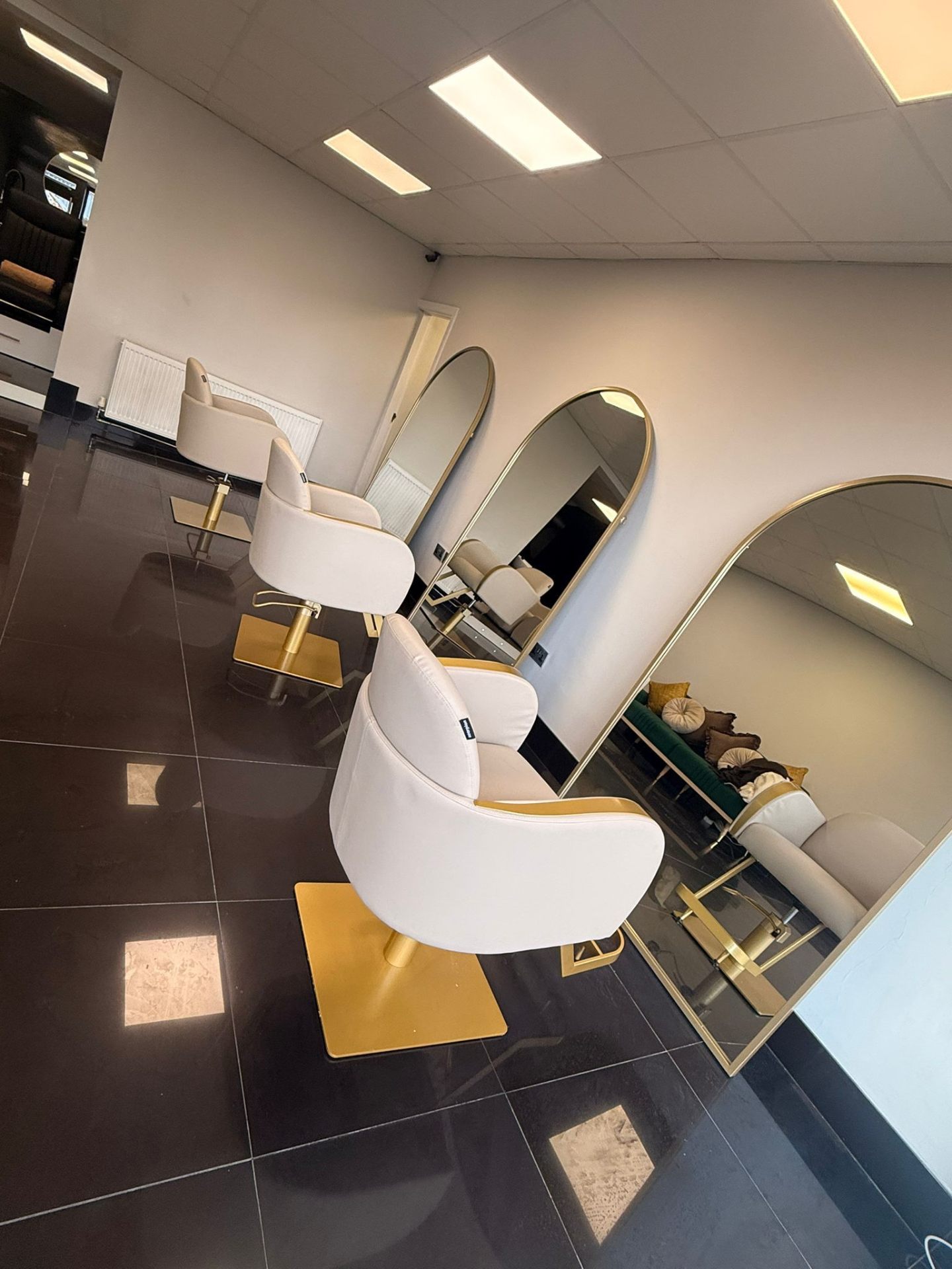 Opal salon styling stations with arched mirrors